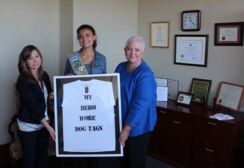 Photo of Left to right:  Jennifer Audette, Social Work Manager Albany Stratton VA Medical Center; Amanda Morgante and Linda Weiss, Director Albany Stratton VA Medical Center holding a t-shirt branded “My Hero Wore Dog Tags