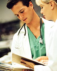 two doctors reviewing patient charts
